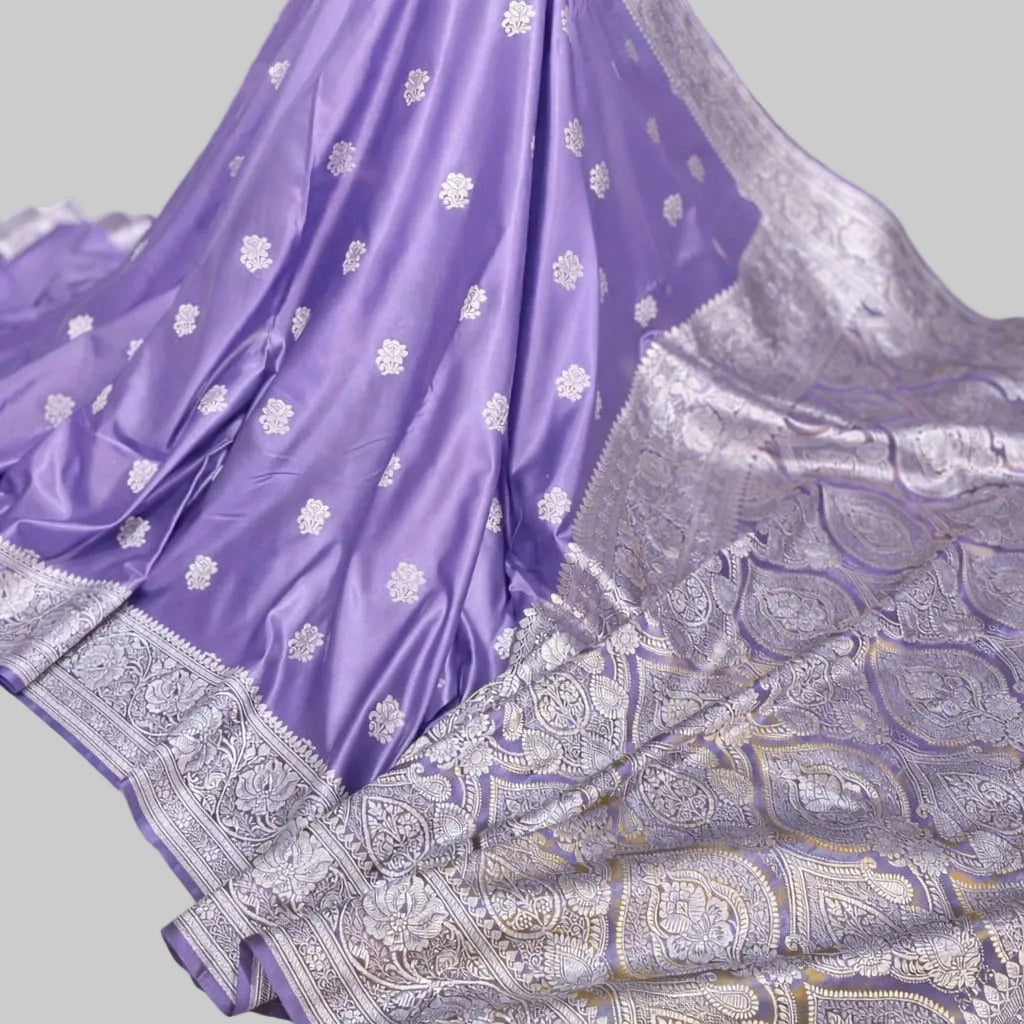 Purple saree with silver patterns on a white background