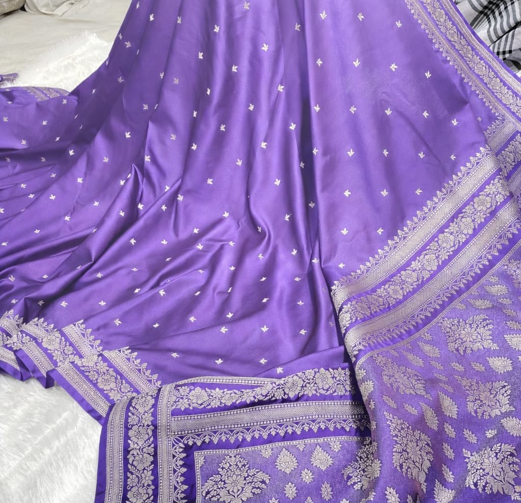 Purple saree with silver patterns on a white background