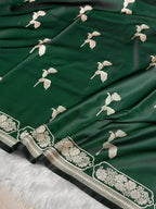 Green fabric with white floral embroidery