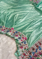 Light green fabric with colorful floral border