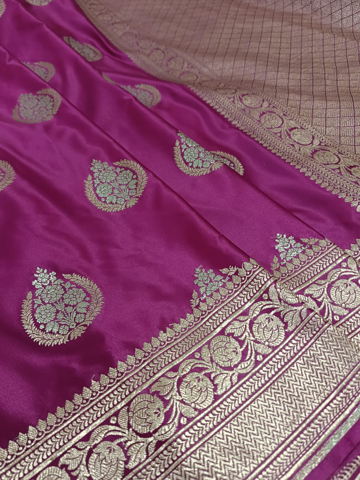 Purple fabric with gold embroidery and patterns