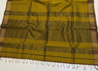 Yellow and brown checkered fabric with a plain background