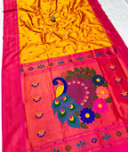 Saree with yellow and pink design on a white background