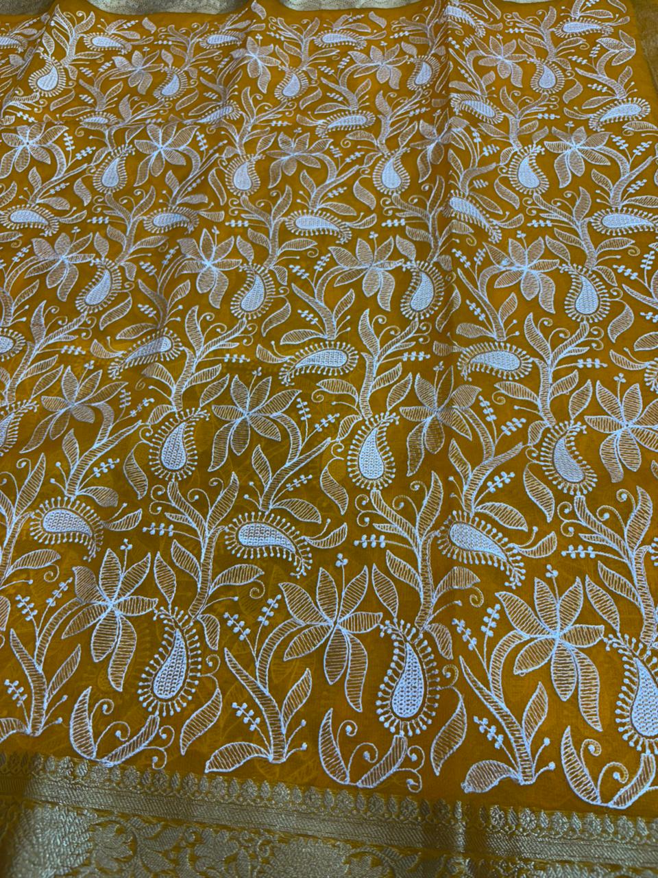 Yellow fabric with white floral pattern