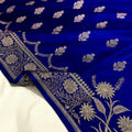 Blue fabric with white floral patterns on a white background