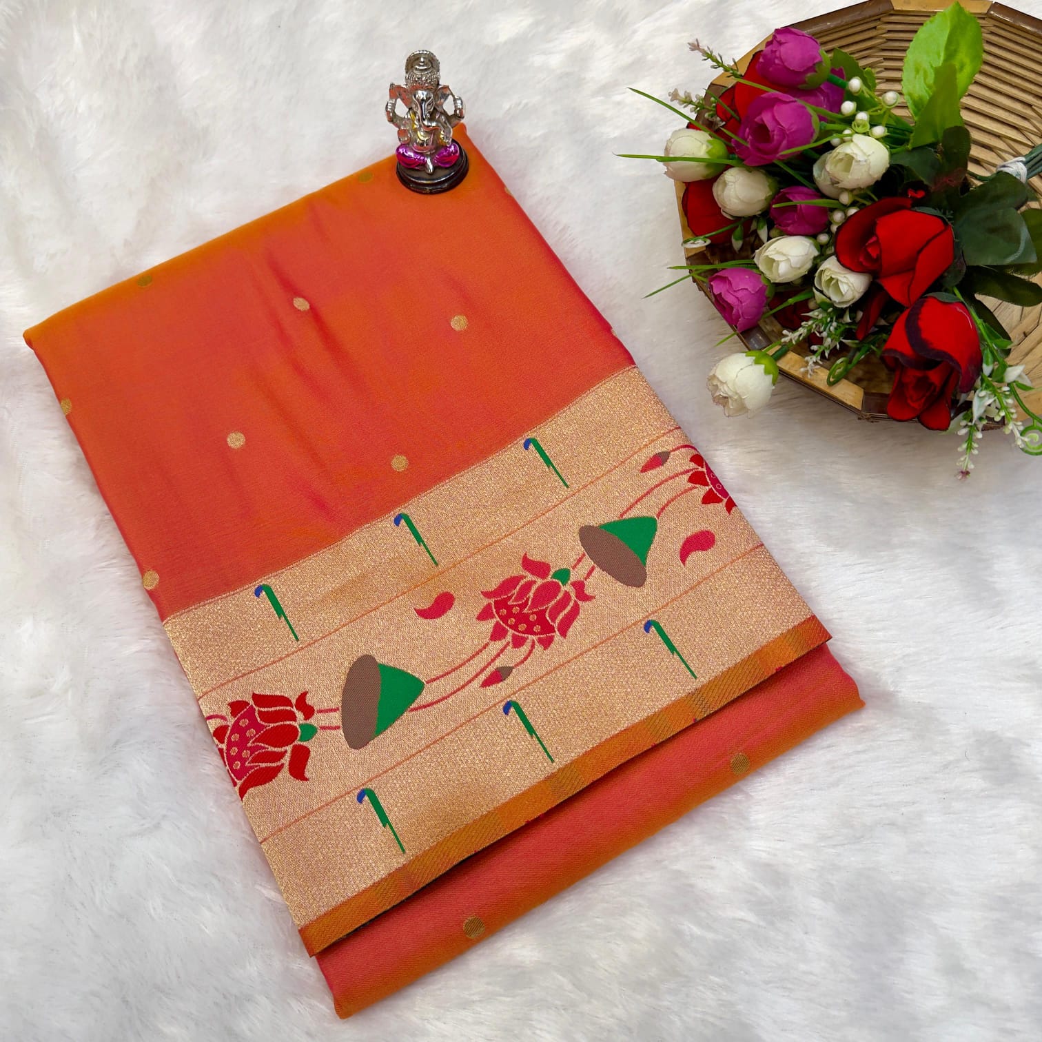 Orange fabric with floral patterns on a white background