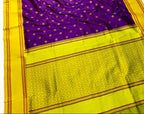 Purple saree with yellow border on a white background