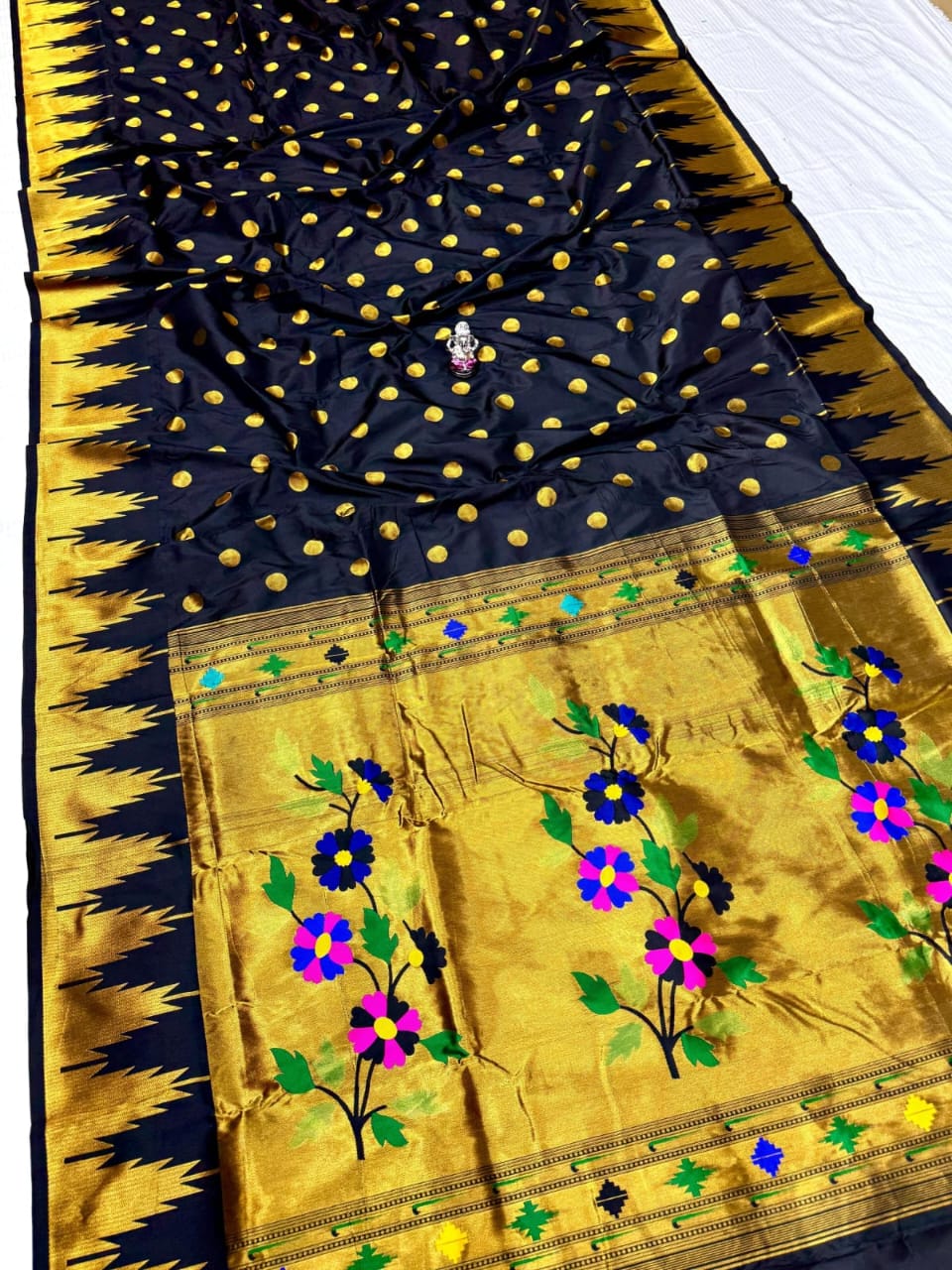 Black saree with gold border and floral embroidery on a white background