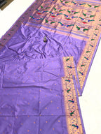 Purple fabric with colorful patterns on a white background