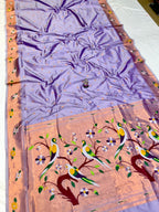 Saree with a floral and bird design on a pink background