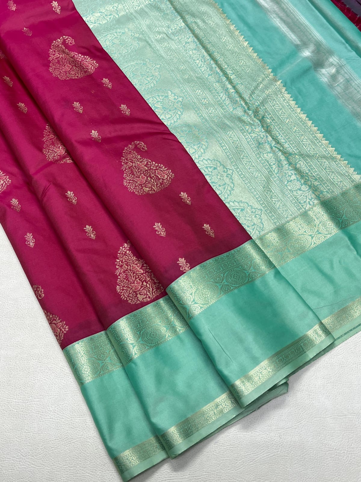 Saree with pink and green colors on a white background