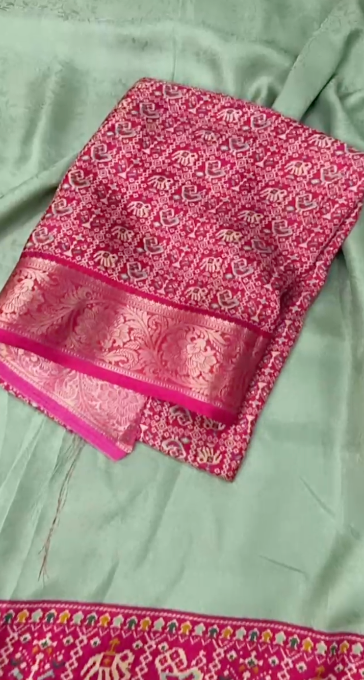 Light green fabric with pink and red patterned border