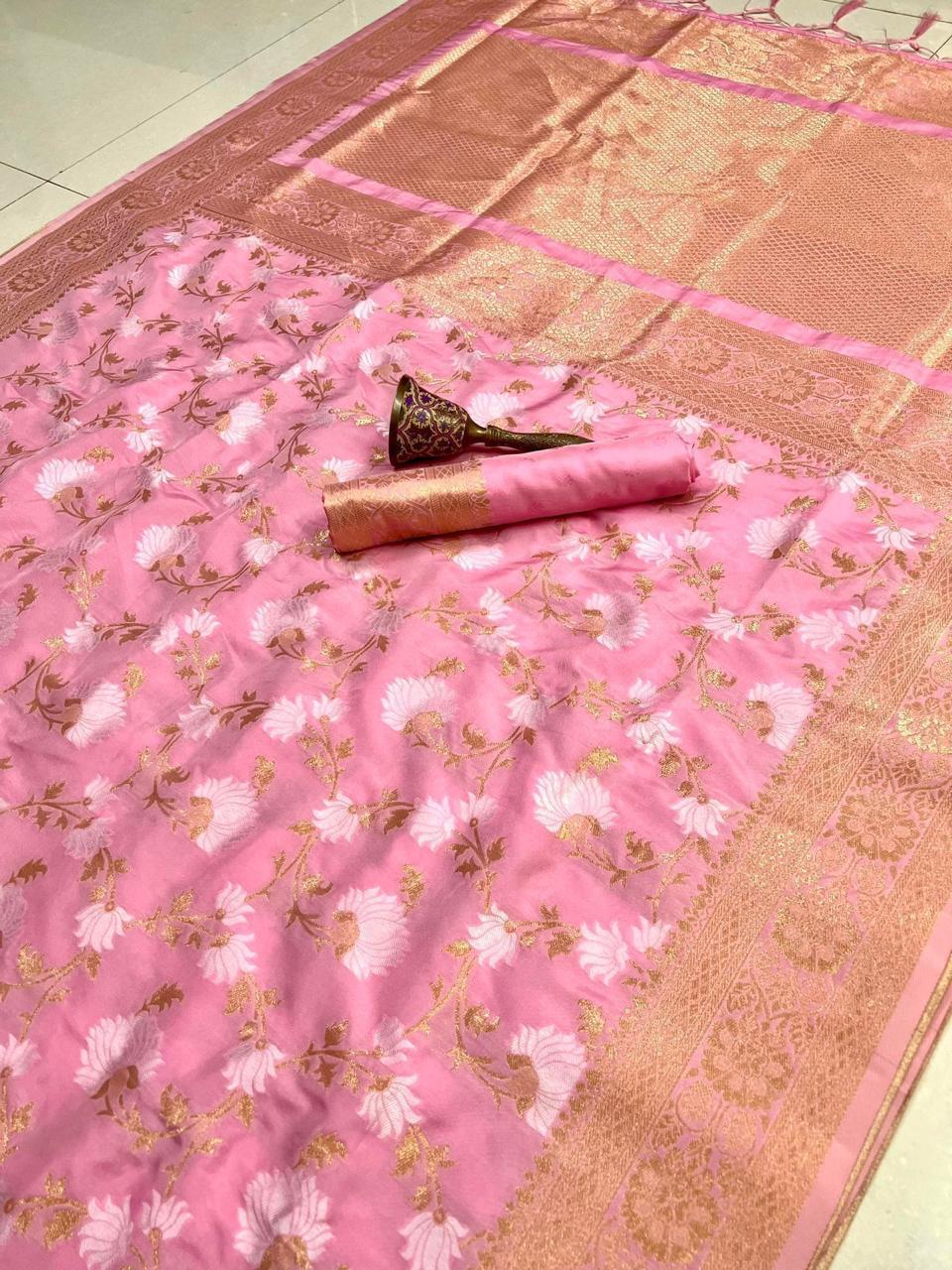 Pink saree with floral patterns on a checkered floor