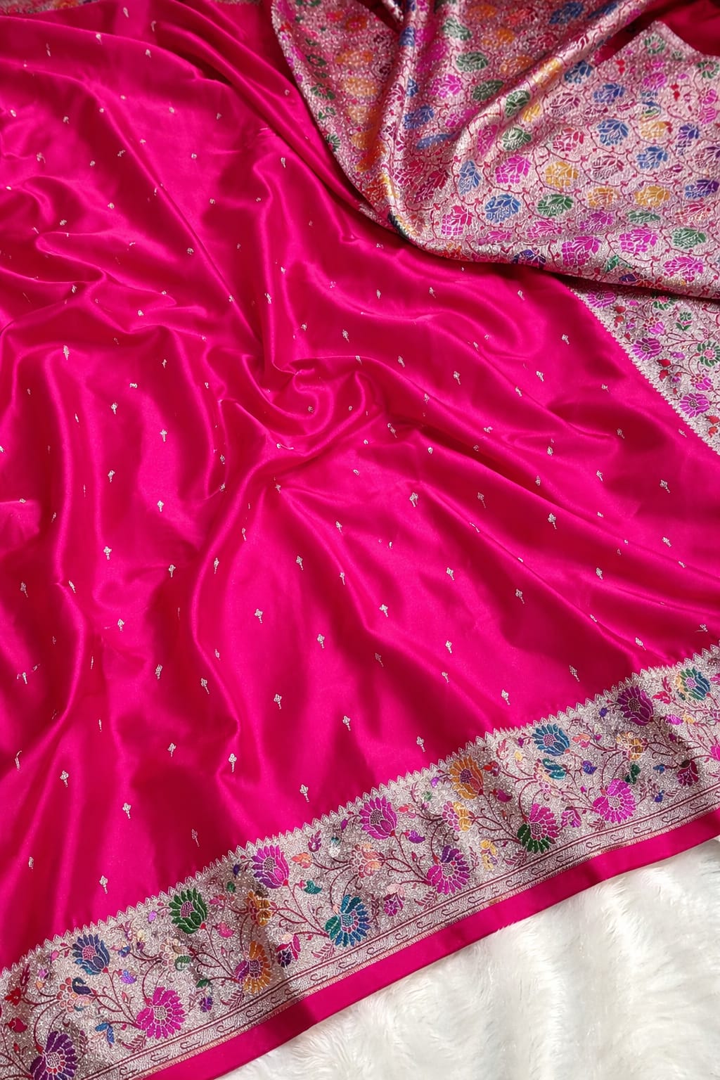Pink saree with floral patterns and embroidery