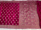 Purple fabric with intricate white patterns on a white background