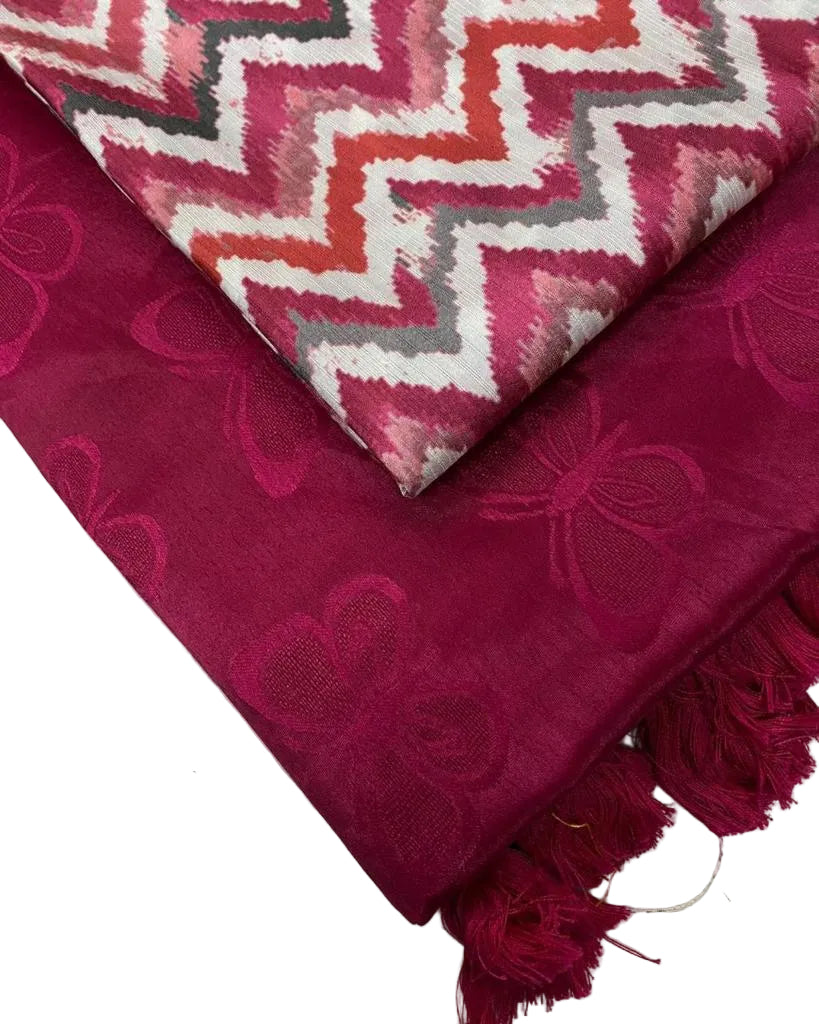 Two pieces of fabric with a pink and white zigzag pattern and a magenta butterfly design on a light background.