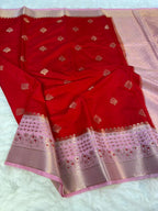 Red saree with gold patterns on a white background