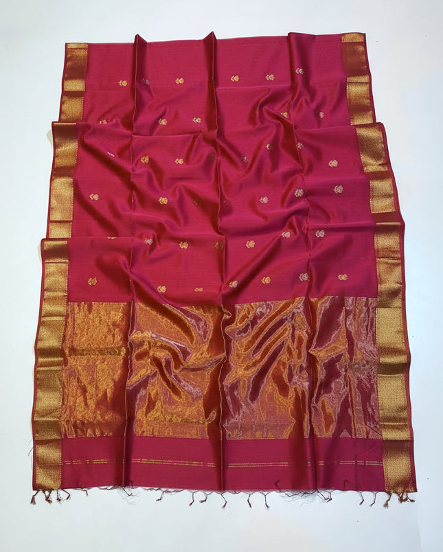 Red and gold saree with decorative patterns on a white background