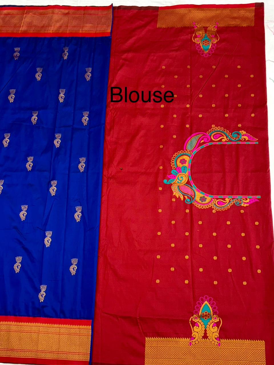 Red and blue saree with intricate designs on a white background