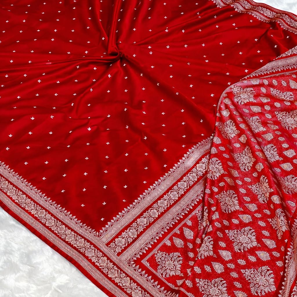 Red fabric with white patterns on a white background