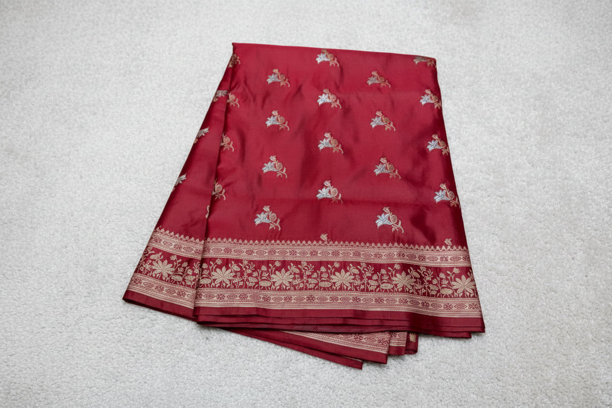 Red fabric with white floral patterns on a red background