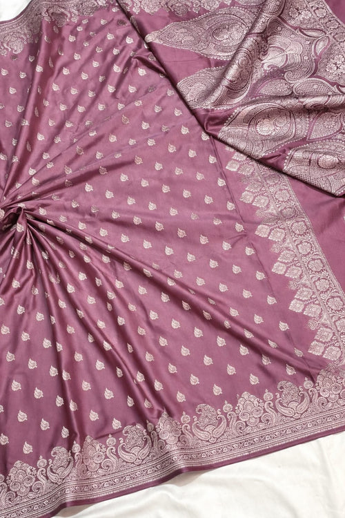 Purple saree with white floral patterns on a white background
