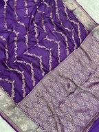 Purple fabric with intricate silver embroidery
