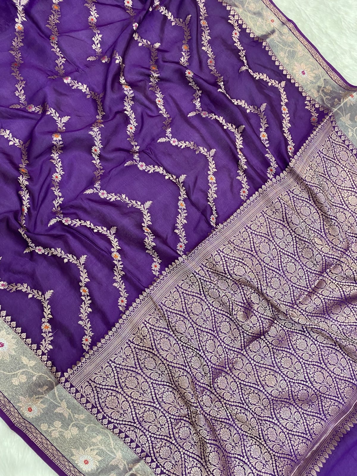 Purple fabric with intricate silver embroidery
