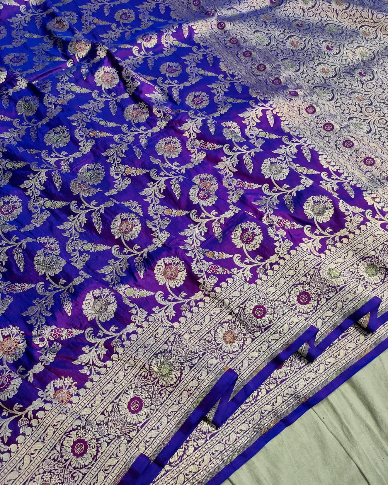 Blue and purple floral patterned fabric with intricate designs