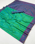 Green saree with purple border on a white background