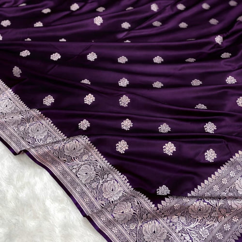 Purple saree with white floral patterns on a white background