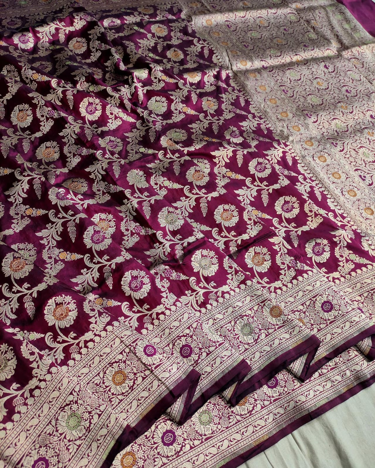 Purple and white patterned fabric with intricate designs