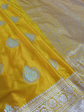Yellow fabric with intricate white patterns