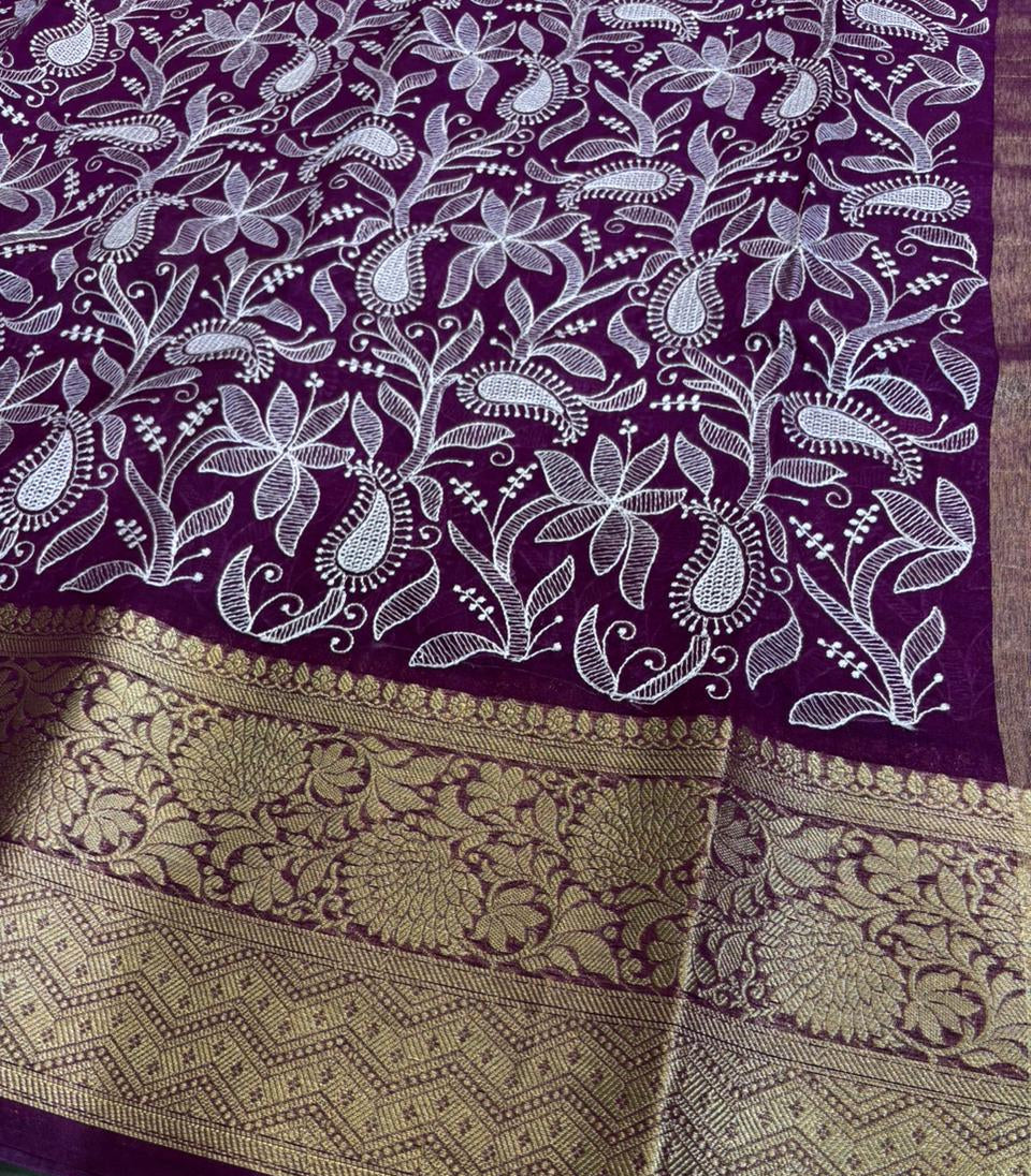 Purple fabric with white floral patterns and gold border